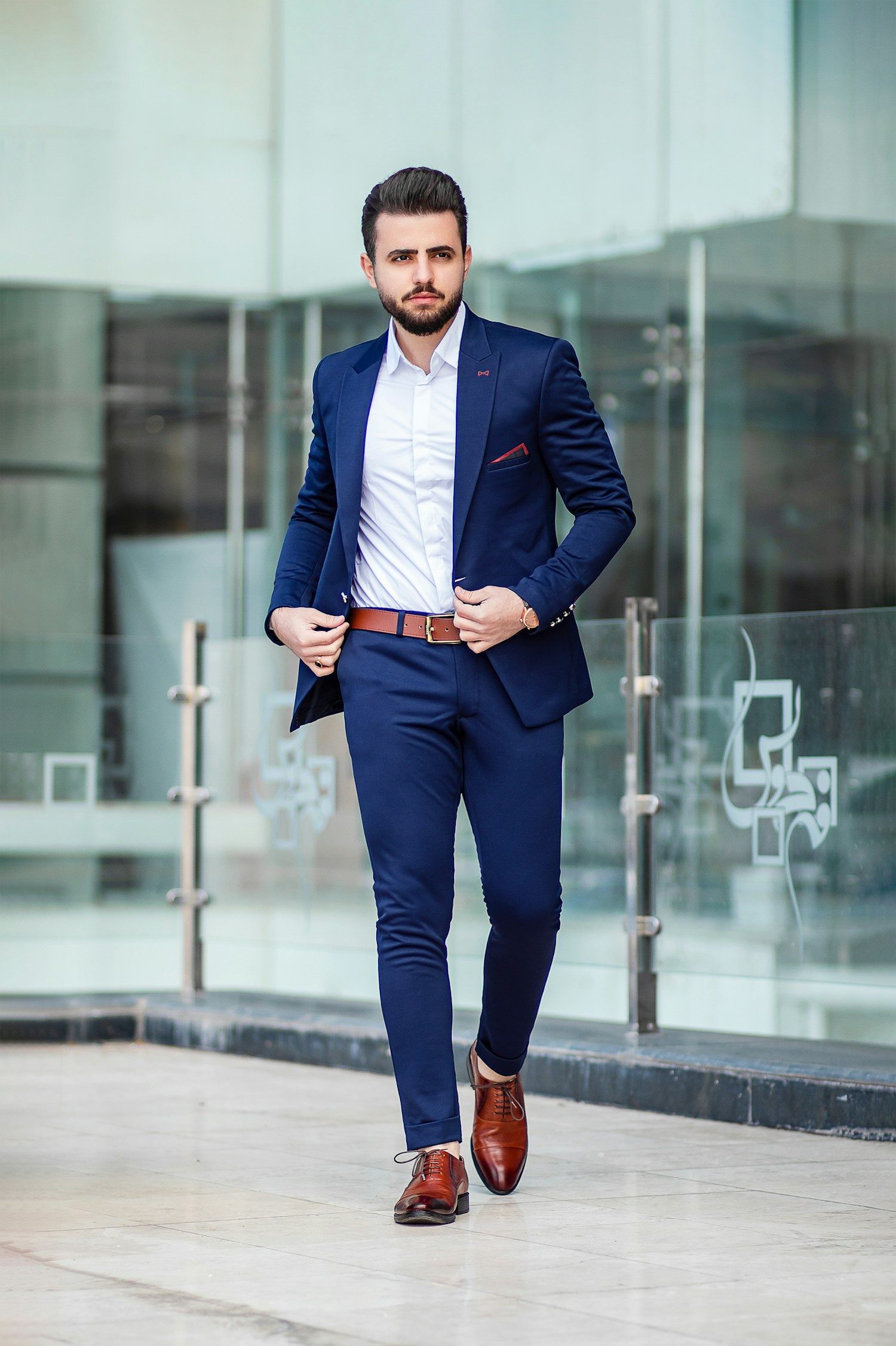 Menswear inspiration: a navy suit with brown leather accessories